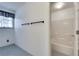 This bathroom features a window with a black and white valance and shower with tub at 3550 Gravitt Rd, Cumming, GA 30040