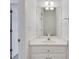 Half bathroom with white vanity, modern lighting, and neutral paint at 3550 Gravitt Rd, Cumming, GA 30040