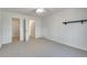 Bright bedroom with an ensuite entrance, neutral carpet, and an open doorway at 3550 Gravitt Rd, Cumming, GA 30040