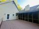 Expansive wooden deck flows from the home to a cozy screened porch, perfect for outdoor gatherings at 3550 Gravitt Rd, Cumming, GA 30040