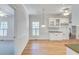 Bright dining room with hardwood floors, white walls, and a decorative pendant light at 3550 Gravitt Rd, Cumming, GA 30040
