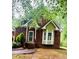 Beautiful brick home with lush landscaping, featuring a bay window and inviting entrance at 3550 Gravitt Rd, Cumming, GA 30040