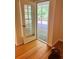 Hallway with a french door view to a deck overlooking a wooded area at 3550 Gravitt Rd, Cumming, GA 30040