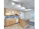 Basement kitchenette features wooden cabinets, a compact stove, and a convenient island area at 3550 Gravitt Rd, Cumming, GA 30040