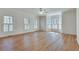 Large living room featuring hardwood floors, bright windows, and a ceiling fan at 3550 Gravitt Rd, Cumming, GA 30040