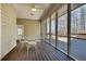 Spacious screened porch with ceiling fan and scenic backyard views at 3550 Gravitt Rd, Cumming, GA 30040