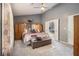 Spacious main bedroom features vaulted ceiling, a large bed, and ensuite access at 5936 Old Wellborn Trce, Lithonia, GA 30058
