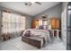 Spacious main bedroom features vaulted ceiling, a large bed, and ensuite access at 5936 Old Wellborn Trce, Lithonia, GA 30058