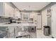 Bright kitchen featuring white cabinetry, stainless steel appliances, and an island with counter seating at 5936 Old Wellborn Trce, Lithonia, GA 30058