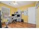 Bright office space with laminated wood flooring, featuring built in storage and a workspace at 5936 Old Wellborn Trce, Lithonia, GA 30058
