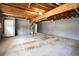 Unfinished basement area with exposed ceiling, concrete floor, and plumbing showing renovation potential at 3807 Memorial Nw Pkwy, Kennesaw, GA 30152