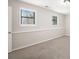 Bedroom with carpet flooring and large windows providing natural light at 3807 Memorial Nw Pkwy, Kennesaw, GA 30152