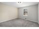 Cozy bedroom with carpet flooring and a window with natural light at 3807 Memorial Nw Pkwy, Kennesaw, GA 30152