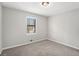 Comfortable bedroom with carpet flooring and a window with natural light at 3807 Memorial Nw Pkwy, Kennesaw, GA 30152