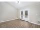 Bright dining area featuring hardwood floors and double doors leading to outdoor deck at 3807 Memorial Nw Pkwy, Kennesaw, GA 30152