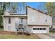 Charming home featuring a front porch with grey painted wood, and an attached two-car garage at 3807 Memorial Nw Pkwy, Kennesaw, GA 30152