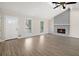 Inviting living room boasts a fireplace, vaulted ceiling and abundant natural light at 3807 Memorial Nw Pkwy, Kennesaw, GA 30152