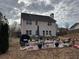 Large backyard featuring a patio with seating area and views of the house at 398 Kyles Cir, Hiram, GA 30141