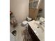 A bathroom with a sink, vanity, and toilet offering functionality and style at 398 Kyles Cir, Hiram, GA 30141