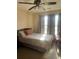 Comfortable bedroom with natural light from windows covered by patterned curtains at 398 Kyles Cir, Hiram, GA 30141