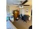 Cozy bedroom featuring a ceiling fan, natural light, and a comfortable workspace at 398 Kyles Cir, Hiram, GA 30141