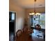 Inviting dining room with chandelier lighting and a window view at 398 Kyles Cir, Hiram, GA 30141