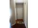 Neutral hallway features a white front door and hardwood floors at 398 Kyles Cir, Hiram, GA 30141