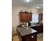 Spacious kitchen with dark cabinets, granite countertops, and a breakfast bar at 398 Kyles Cir, Hiram, GA 30141