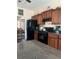 Functional kitchen with dark cabinets and a view of the dining area at 398 Kyles Cir, Hiram, GA 30141