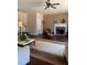 Cozy living room featuring a fireplace, ceiling fan and large rug over hardwood floors at 398 Kyles Cir, Hiram, GA 30141