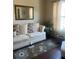 Cozy living room featuring a striped sofa and a large mirror at 398 Kyles Cir, Hiram, GA 30141