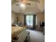 Spacious main bedroom with sitting area, carpeted floor, and lots of natural light at 398 Kyles Cir, Hiram, GA 30141