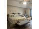 Spacious main bedroom with sitting area, neutral walls, and ceiling fan at 398 Kyles Cir, Hiram, GA 30141