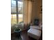 Comfortable sitting area with a tufted chair and natural light at 398 Kyles Cir, Hiram, GA 30141