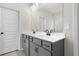 Elegant bathroom with a double vanity, white countertop, modern black hardware, and sleek fixtures under soft lighting at 712 Shetland Trl, Cartersville, GA 30121