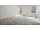 Bedroom featuring neutral carpet and two windows for natural light at 712 Shetland Trl, Cartersville, GA 30121