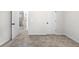 Spacious bedroom featuring soft, neutral carpeting and bright white walls, enhanced by natural light from nearby doors and hallways at 712 Shetland Trl, Cartersville, GA 30121