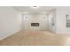 Bright and airy living room features modern fireplace, hardwood floors and neutral color palette throughout at 712 Shetland Trl, Cartersville, GA 30121