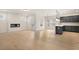 Spacious living area with hardwood floors, a fireplace, and an open layout connected to the modern kitchen at 712 Shetland Trl, Cartersville, GA 30121