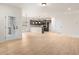 Open concept living space featuring a view of the kitchen, hardwood floors, and natural light from the window at 712 Shetland Trl, Cartersville, GA 30121