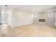 Spacious and well-lit living area with hardwood floors, fireplace and view of the entrance at 712 Shetland Trl, Cartersville, GA 30121