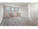 Spacious loft area with carpet, three windows, and access to additional rooms at 712 Shetland Trl, Cartersville, GA 30121