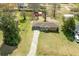 Aerial view of a single-story brick home with a long driveway and spacious front yard at 2852 Crabapple Lane, Dacula, GA 30019