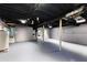 Unfinished basement with exposed ceiling, gray concrete floor, and white water heater at 2852 Crabapple Lane, Dacula, GA 30019