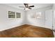 Sun-filled bedroom with hardwood floors, two large windows, ceiling fan and closet at 2852 Crabapple Lane, Dacula, GA 30019