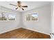 Bedroom featuring hardwood floors, natural light, and a ceiling fan at 2852 Crabapple Lane, Dacula, GA 30019