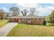 Charming brick home with a carport and landscaped front yard showcasing classic suburban appeal at 2852 Crabapple Lane, Dacula, GA 30019