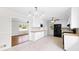 Well-lit kitchen featuring white cabinets, modern black appliances, and a functional layout at 2852 Crabapple Lane, Dacula, GA 30019