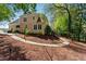 Large, landscaped backyard with a walking path and a view of the home at 4441 Langdon Se Walk, Smyrna, GA 30080