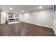 Large finished basement area with neutral paint and hardwood floors at 4441 Langdon Se Walk, Smyrna, GA 30080
